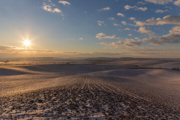 Fototapeta na wymiar Beautiful winter snowy landscape at sunset.