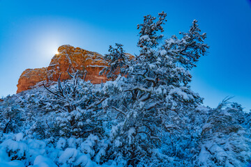 The Sun Peaks Over Courthouse Butte in Winter