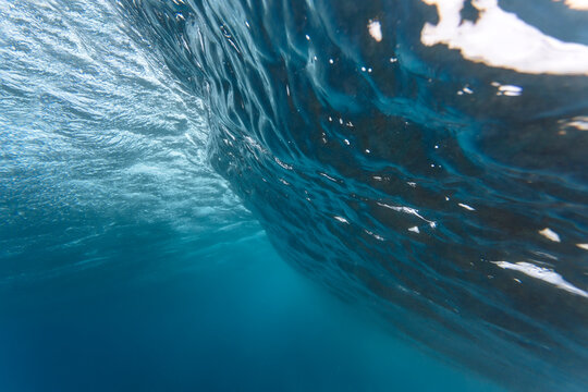 Low angle view of waves breaking in sea at Maldives