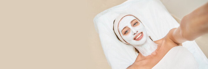 Portrait of moisturizing mask on white background for medical design. Woman skin procedure. Natural cosmetic products. Beauty face. Facial cosmetology treatment. Healthcare. Selfie at spa center