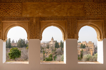 view of detailed and ornate Moorish and Arabic decoration in the arched windows of the Generalife Palace