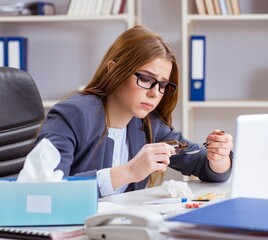 Businesswoman employee sick in the office