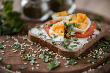 sliced bread with eggs, tomatoes and sour cream. Diet sandwich