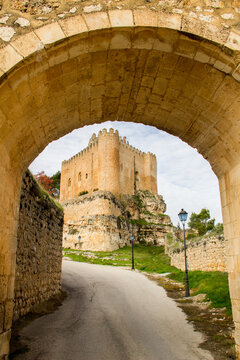 views of alarcon from the road, under stone archway