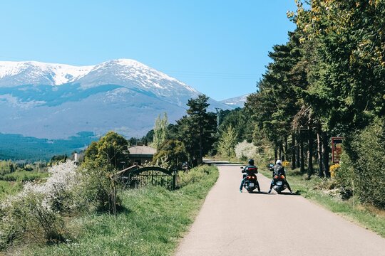 Mountain landscape with two motorbike riders