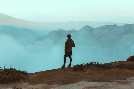 Young man looking at Ijen lake