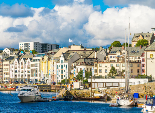 Boats moored along Brosundet Canal, Alesund, Norway
