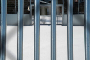 Sports field with soccer goal and bars abandoned in the snow