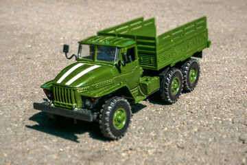 Toy military vehicle on the road