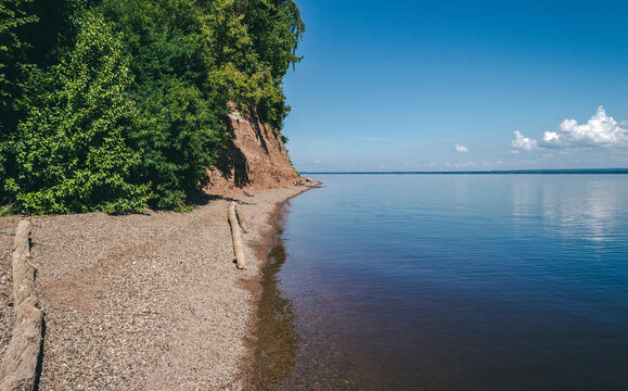 Shoreline landscape of blue lake, summer relaxing view