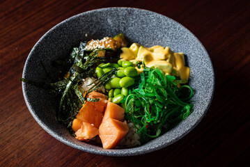 buddha bowl with fish and seaweed