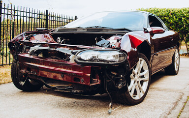 Crashed muscle car dashed dreams side view