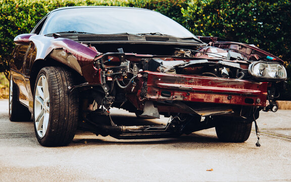 Crashed muscle car and dashed dreams
