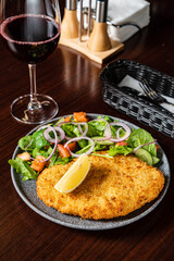 schnitzel with fresh sald and lemon