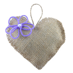 Heart shaped fabric souvenir on a white background.