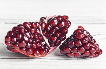 Garnet. Fruit of a juicy pomegranate in a cut.
