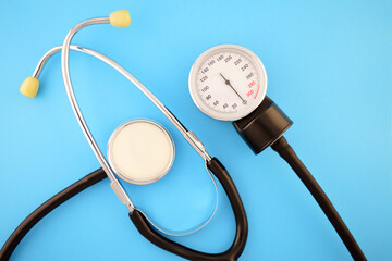 Tonometer for measuring blood pressure on a blue background.