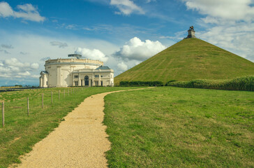 Belgium - Wallonia - Lion's Mound (Butte du Lion) memorial site, a conical artificial hill, and old panorama building located in Braine-l'Alleud comemmorating the battle of Waterloo - obrazy, fototapety, plakaty