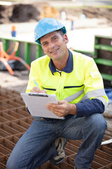 builder working on foundations at construction site