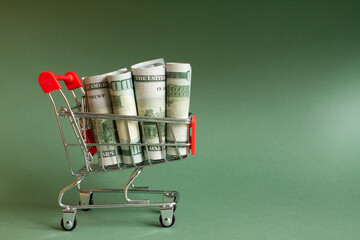 American dollars in a metal basket. Ideas for making dollars, trading online. World business...