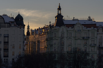 Fototapeta premium .silhouettes of prague architecture and light from the setting sun in winter in the center of prague