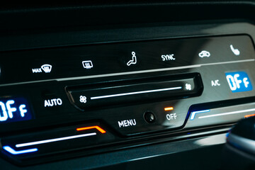 New modern sensor car climate control panel or console of air conditioner, sensor buttons, close up.