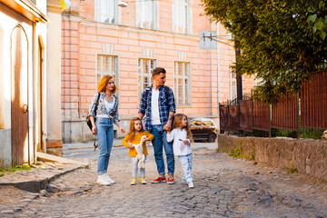 Uzhhorod downtown excursion of young family and their small kids