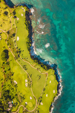 Aerial view of a luxury resort and golf course facing the Ocean with waves crashing on the beach, Mar&iacute;a Trinidad S&aacute;nchez, Dominican Republic.