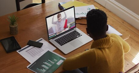 African american female teacher using laptop on video call with schoolboy - Powered by Adobe
