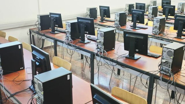 Empty modern multimedia classroom with computers
