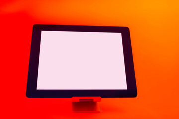 Tablet with white screen. Mockup set against bright, red creative light.