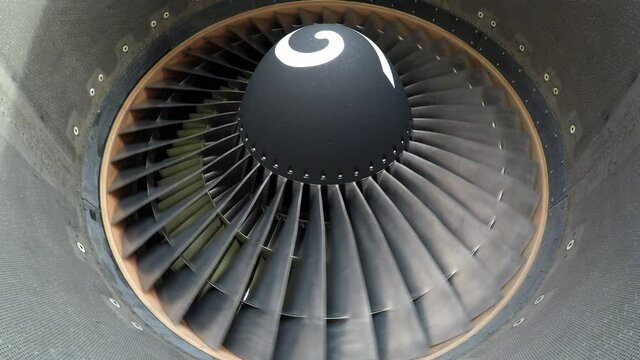 Widebody aircraft engine slowly turning in the wind.
