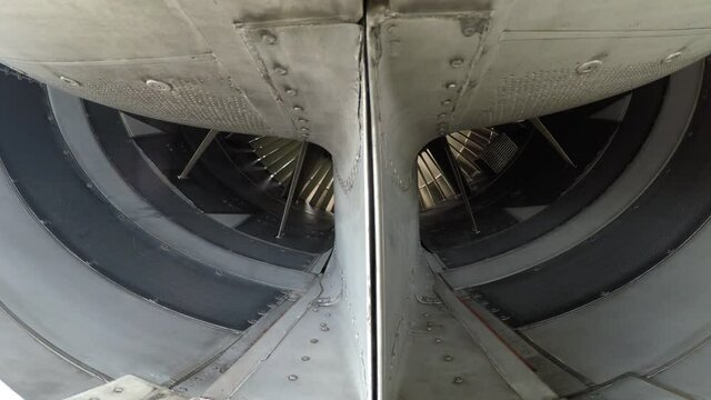 Widebody aircraft engine slowly turning in the wind.