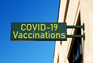 COVID-19 vaccination campaign material: Photo illustration indicates location for COVID-19...