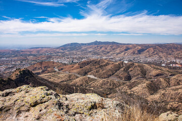 Panoramic Aerial view of Guanajuato, Mexico surrounded by mountains.
