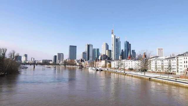Frankfurt Skyline And Eiserner Steg (Iron Footbridge) Over Main River With Passenger Ship At Daytime From Alte Brucke Bridge In Frankfurt am Main, Germany. - wide shot