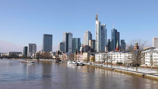 Frankfurt Skyline And Eiserner Steg (Iron Footbridge) Over Main River With Barge Ship From Alte Brucke In Frankfurt am Main, Germany. - wide shot