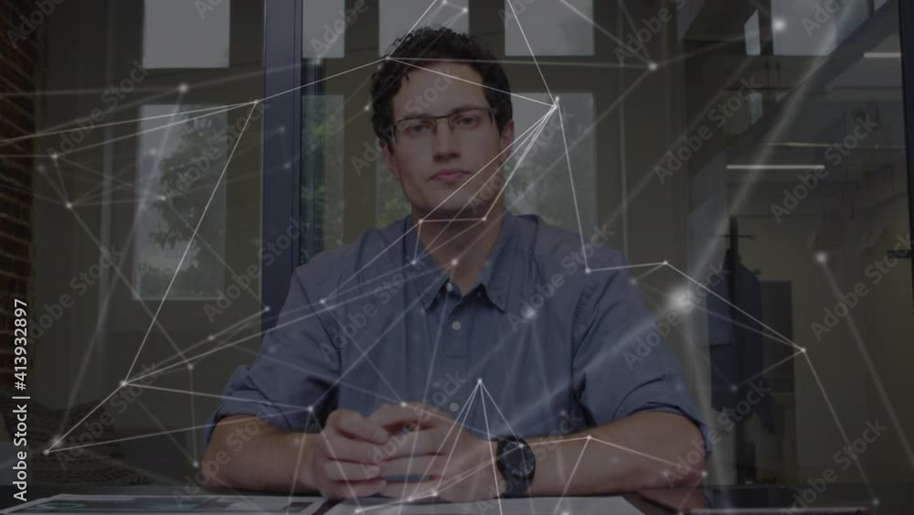 Poster digital composite video of network of connections against caucasian man reading documents at office