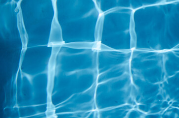 Blue swimming pool water background.