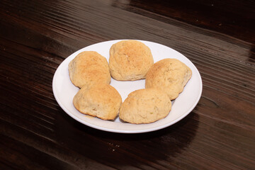 Fives pieces of homemade bread on a white plate