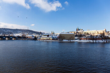 Naklejka na ściany i meble Snowy Prague Lesser Town with Prague Castle above River Vltava in the sunny Day , Czech republic
