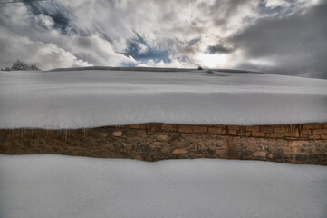 Winter mountain village landscape with snow and cute little houses, beautiful nature panoramic background