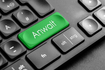 grüne Anwalt Taste auf einer dunklen Tastatur