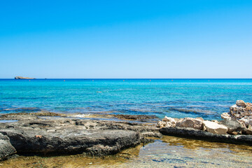 Beautiful rocky beach  on the shore of Mediterranean Sea