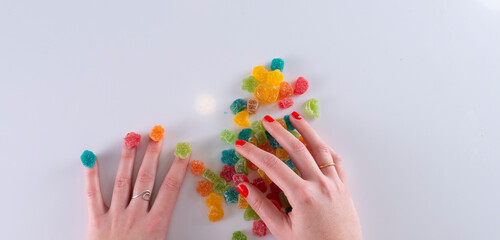 Multi-coloured candies, Multi-coloured candies in a pink bowl and with background