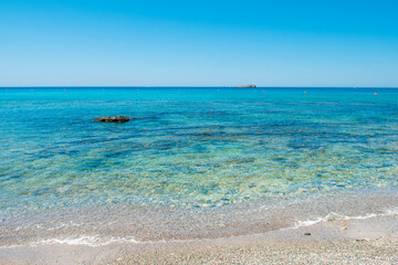 Beautiful rocky beach  on the shore of Mediterranean Sea