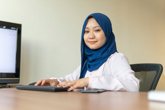 Malay Lady Using Laptop At Home