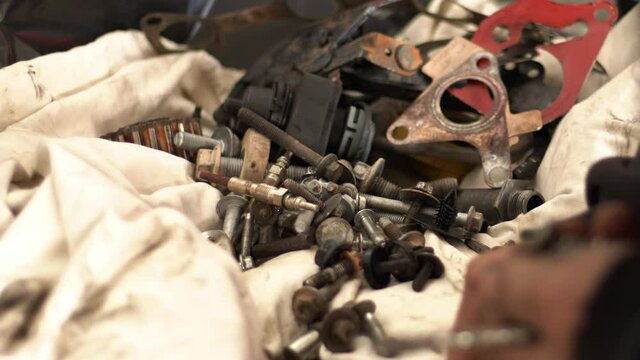 The Craftsman Serviceman Car  In The Repair Shop Lets The Suitable Screws While Gathering
