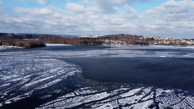 Flight over Lake Bostalsee in Germany on a winters day - aerial view