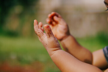 the little boy's hand is praying